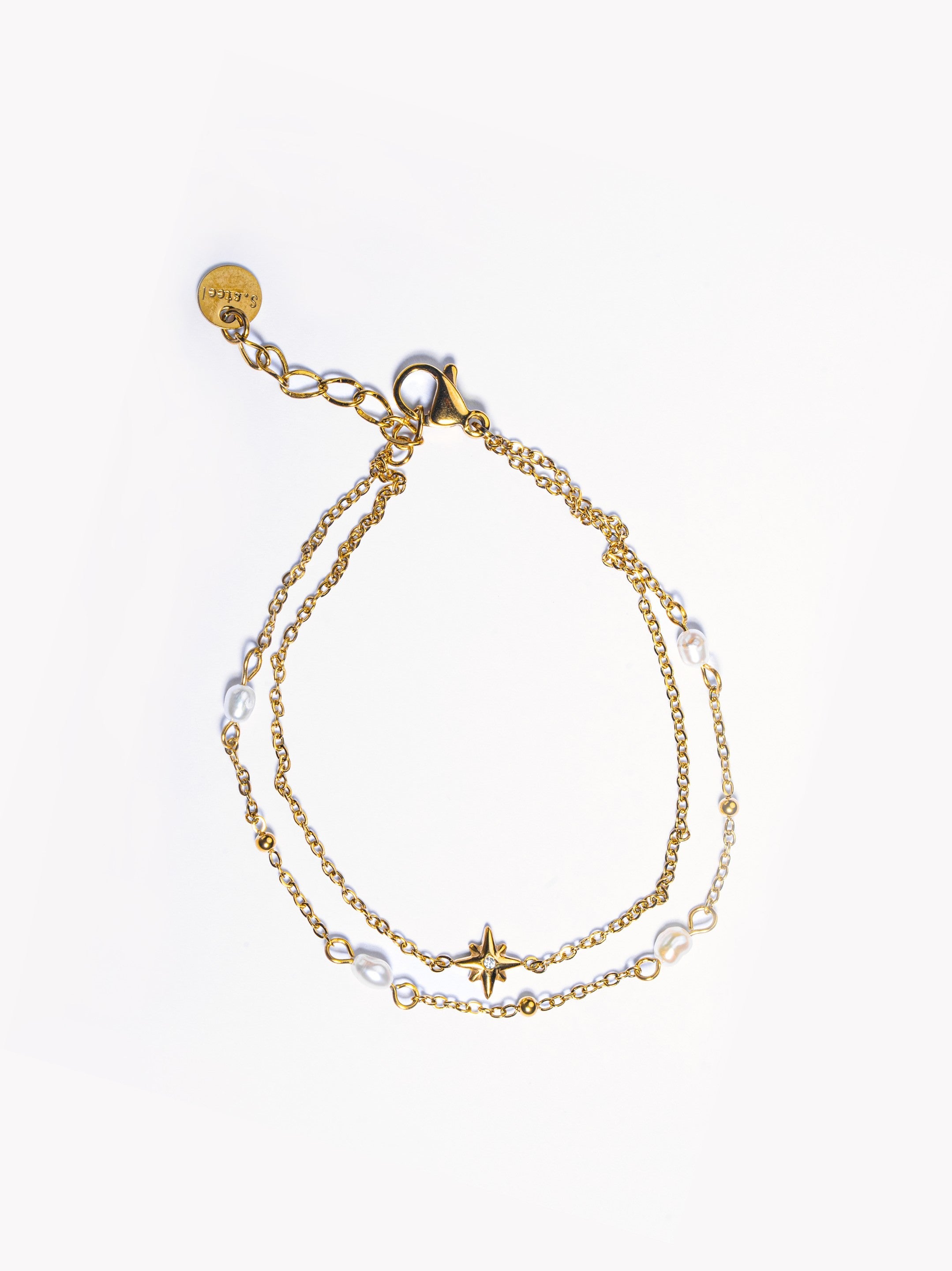 18k gold-plated star pearl bracelet �? minimal elegant star-charm pearl bracelet, anti-tarnish and waterproof for everyday and casual wear.