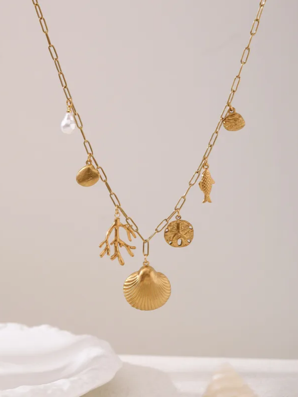 Close-up of shell choker necklace �? 18k gold-plated dramatic shell pendant for evening looks.