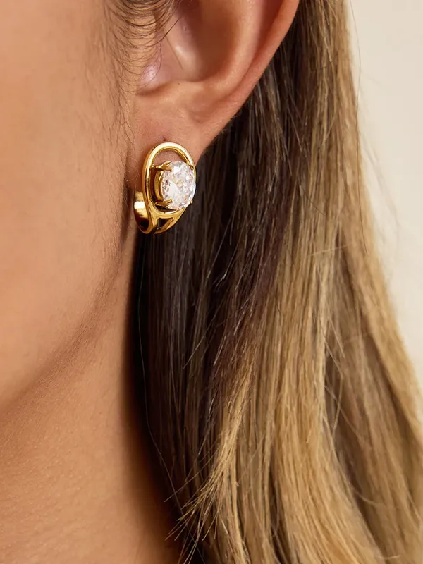 Pair of white stone drop earrings �? 18k gold-plated elegant white stone drops for bridal and gifting.